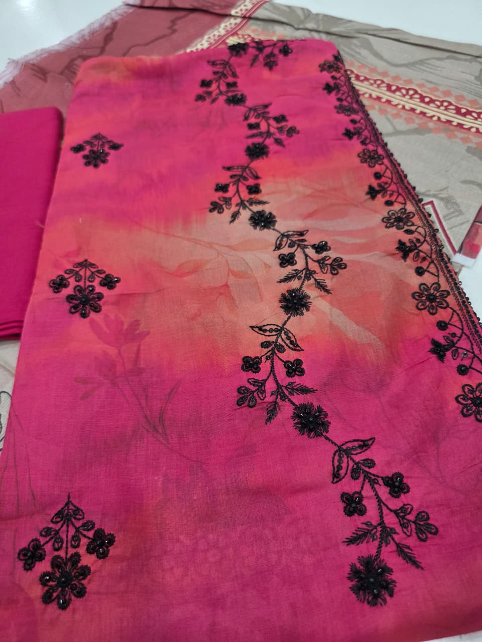 Premium Coral Pink Embroidered Lawn 3 Pc Suit - Unstitched Cut Dana Luxury Neckline Dress with Floral Printed Beige Cotton Net Dupatta
